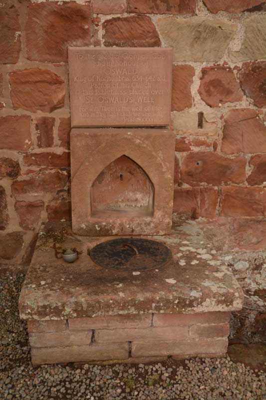 St Oswald's Well which sits at the west end of the church.  Might I be forgiven for initially thinking this was an outside toilet?