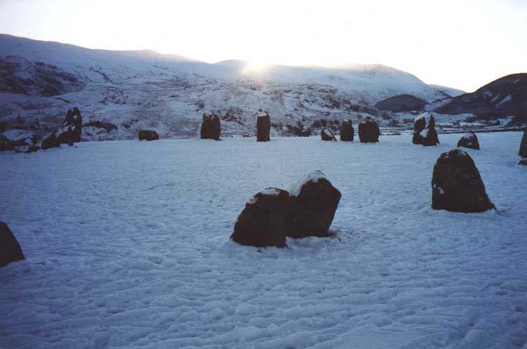 Midwinter at Castlerigg.  This photo  shows the sunrise over Stone 17 from the Double 30/31 at the midwinter solstice, demonstrating one of the number of pairs of stones lining to the MWSR.  

See The Great Stone Circles - How they Work, for further information