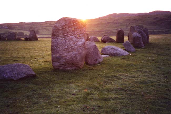 The Midsummer sunrise at Swinside taken 25th June 2003 at 4.57am.  Stone 30 over stones 13/14.

See The Great Stone Circles - How they Work, for further information