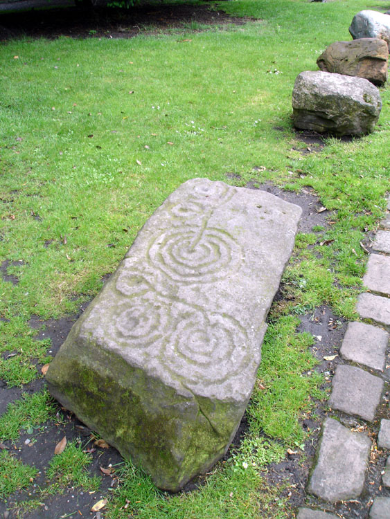 The carved stone residing in the grounds of the Yorkshire Museum.