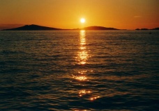 Image 16333 of 59466. Sunset over Samson.  The sacred hills of Samson are crowded with entrance graves and cairns.  In the...