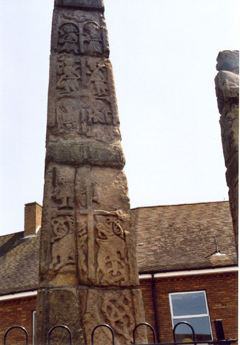 This is a close-up of the back of the tallest market cross at Sandbach, showing its slightly more weathered appearance, compared to the deeply etched front carvings