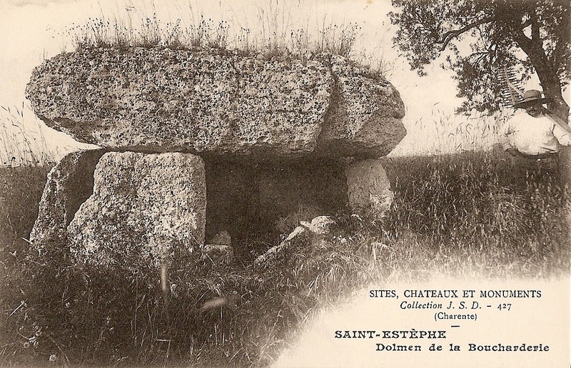 This dolmen is a listed building since April 8th, 1927.

When I visited the village of Roullet Saint Estèphe a the beginning of July, I went to the hamlet of La Boucharderie. I couldn't go nearer the dolmen because of crops. But I'm sure that the man and the tree on the photo are not there anymore!!!!