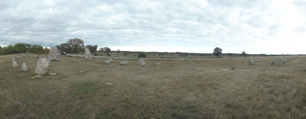 The panoramic view from the mound : (from left to right) northern stone ship, 2 standing stones and southern stone ship with half stone ship (entrance avenue?). Another stone circle, irregular and rectangular stone settings are beyond the windmill, further left (out of sight).