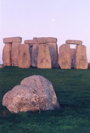 Stonehenge. One more shot of the Station Stone at approx ESE of the circle at Stonehenge, about half an hour after sunrise. You may just see the moon slightly to right of centre, above the centre lintels. This was the most northerly rising moon on the previous evening, 5th December 2006. (Both shots taken during Private Access visit).