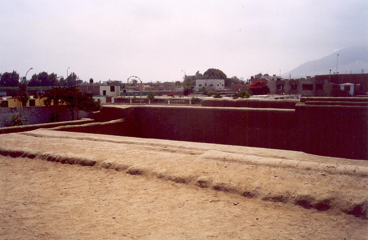 Huaca Esmeralda and surrounding buildings of modern Trujillo (photo taken on July 2003).