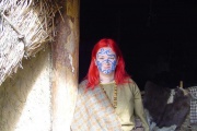 A photograph of me (Hangovermonkey) at the Iron Age Roundhouse at Archaeolink Prehistory Park, Aberdeenshire. I'm a storyteller, so I get away with the hair ;)