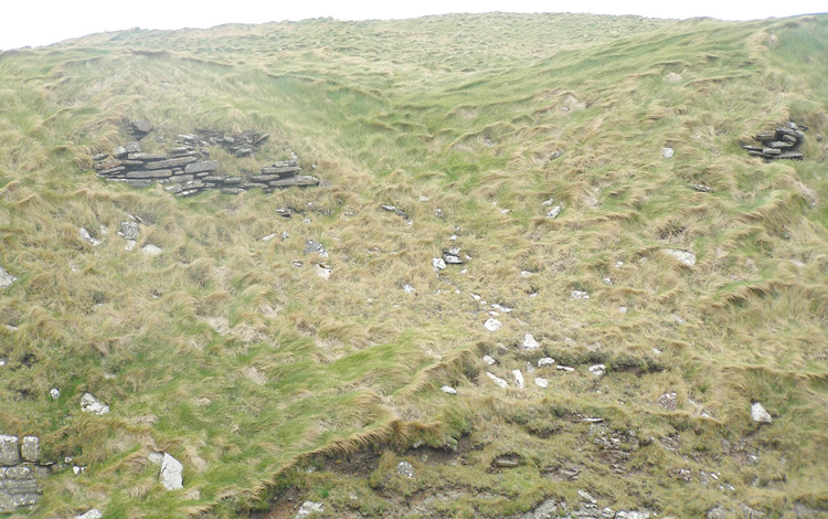 The vallum itself, possible earlier structure wall just visible bottom LH corner