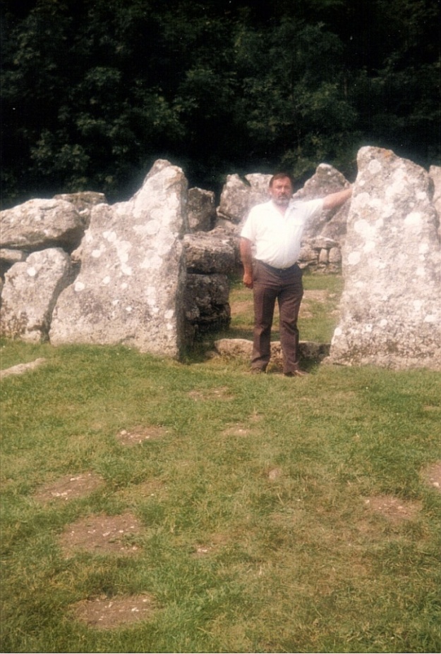 Site in Anglesey (Sir Ynys Mon) Wales: The entrance to the main Round House.I am 5ft 9 ins tall so this stone must be over 6ft.