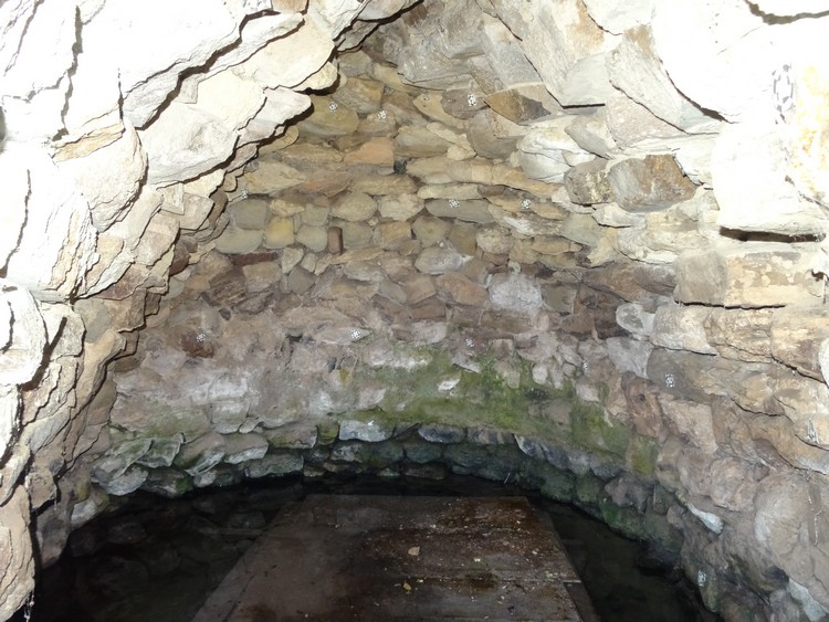 Partly reconstructed tholos chamber of pozzo sacro Monte Ultana (photo taken on April 2017).