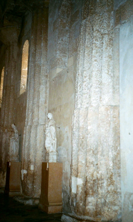 Site in Sicily (Sicilia)

The original Doric columns of the Temple of Athena clearly evident in the outer wall of the cathedral.  

Apologies for the picture quality, it deserves better!