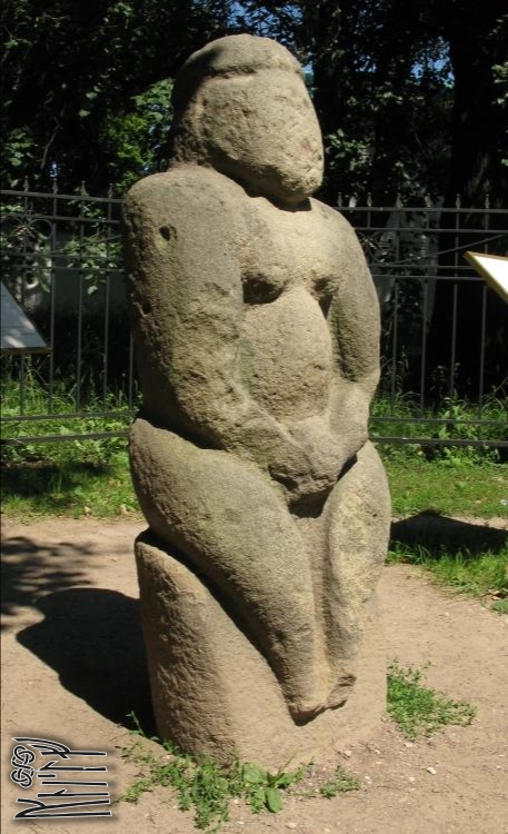 Polovtsian Woman sculptured stone is standing in the eldest oak groove in Moscow. Trees are of 400-600 years old.