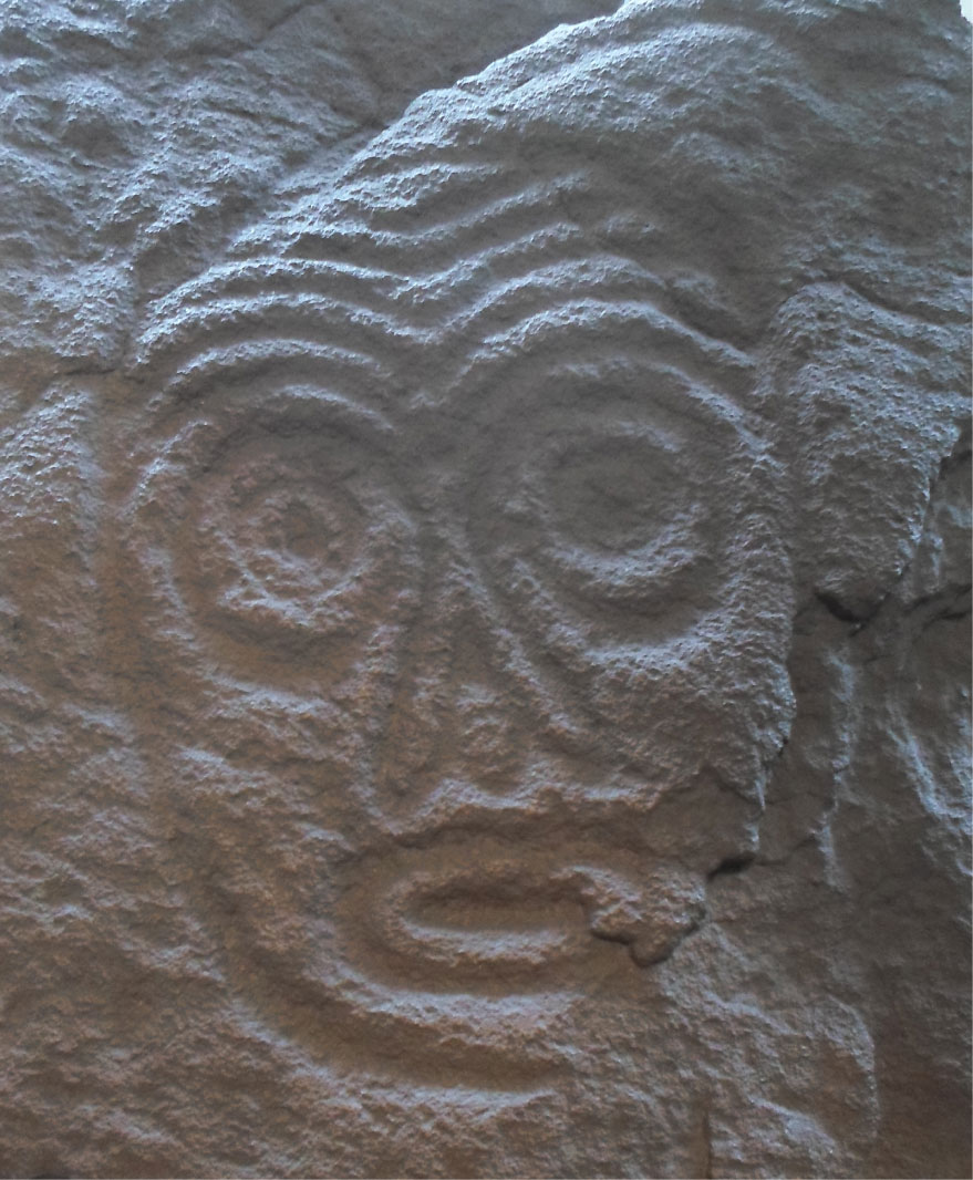 Petroglyph in Sakatschi Aljan (also called Sikachi-Alyan) in Siberia, Russia.

This photo was taken of a basalt stone replica shown in the  Museum of Natural History Nürnberg (Bavaria, Germany). 

The petroglyph is thought to show a mask of a shaman. The original is supposed to have been created in the Neolithic about 5000 - 6000 years ago.

The copy was made from the original stone by Mr B