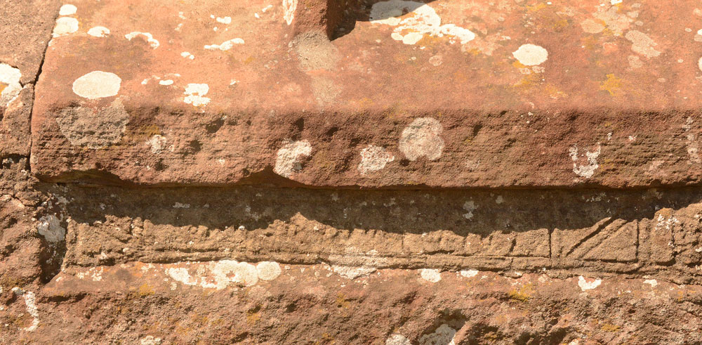 We may not have been able to see the Viking cross head and shaft fragment, but we did spot this underneath the window in the southern external wall of the sanctuary. The notes inside the church say it is the remains of a grave slab, recut for use as a lintel. 