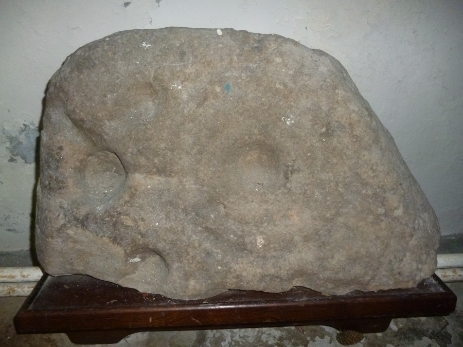 The church is a most unusual and, I'd suggest, attractive building, C12th in origin, or older? Enter through the main door and turn right to find the carved boulder a few yards away. Taken 18-02-2018 and viewed from straight ahead.