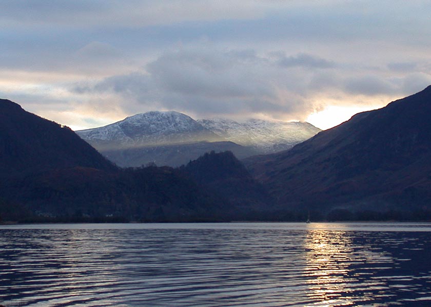 Castle Crag Hillfort
Castle Crag is the small pointed hill in the center of the valley.
The setting winter sun throws a shaft of sunlight through Honister pass into the valley. Magic!