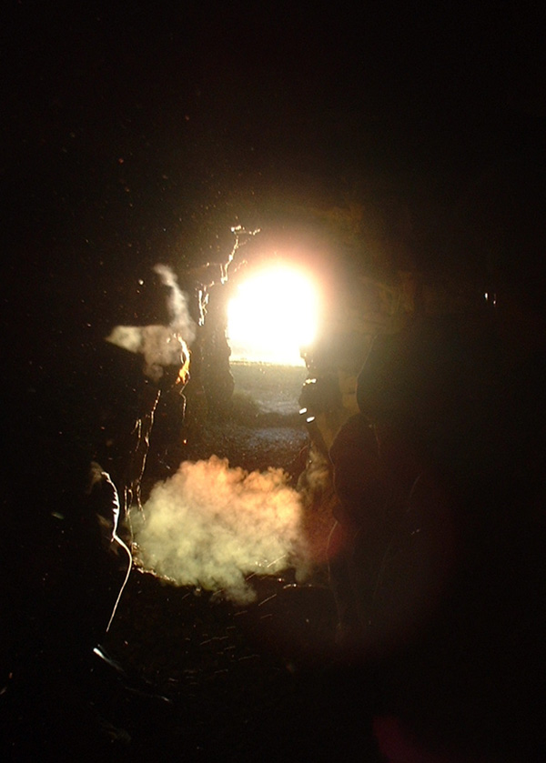 Winter Solstice 2003 Stoney Littleton Long Barrow. What an amazing experience, there were a lot of people there along with candles and incense (yes the place has well and truly been discovered by new-agers!) The sun took a while to appear because of the hills but it was worth the chilly wait to see the light hit the back of the chamber. This pic was taken from inside looking towards the entrance.