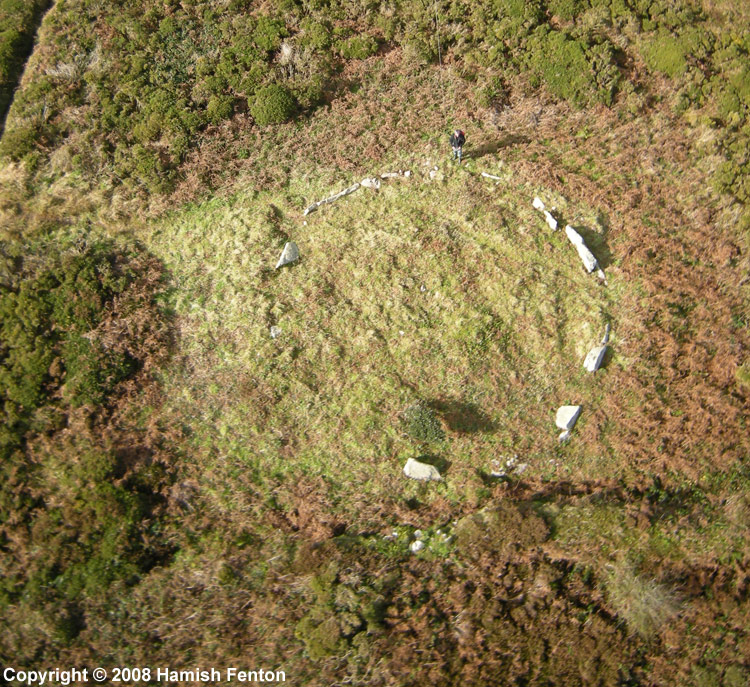 Oblique (almost vertical) aerial view of  a cairn at Boskednan - the kerb stones can be seen clearly. South of Nine Maidens (Boskednan) stone circle. 
The top of the photo is north.   Grid reference SW43493495 
Kite Aerial Photograph,  16 October 2008