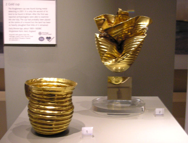 The Rillaton Gold Cup, as on display in the British Museum, along with the deformed Ringlemere gold cup. 