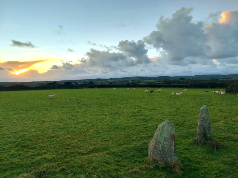Faughan November Sunset at Faughan Settlement and it's Standing Stones within, Note how the near stone is at a right angle to the other stone, I believe that these two stones are the last remaining side stone/Back stone of a Neolithic/Bronze age quoit similar to others in the region, and then far later the two remaining stones were re-used (in situ) in the iron age as the 2 large entrance stones to the fo
