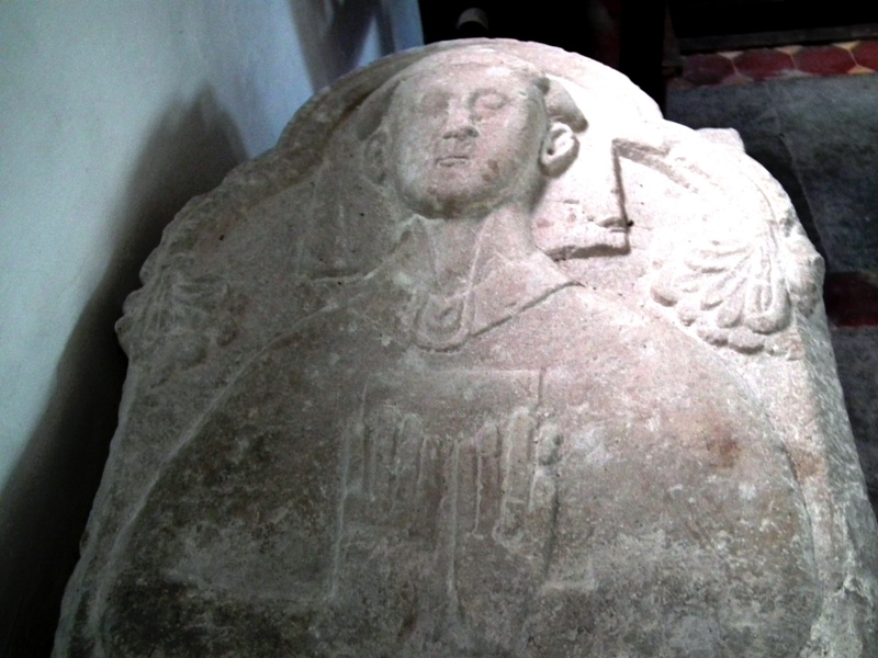 You will find this in the church although it was locked when we arrived, we managed to find the key holder who let us in to take a look. On the second photo I have shown the book page that inspired us to go there of St Ruan cradling a dead bird. I thought it was part of the stone carving although there wasn't any sign of a bird and the caretaker who had been there for 30 years knew nothing about i