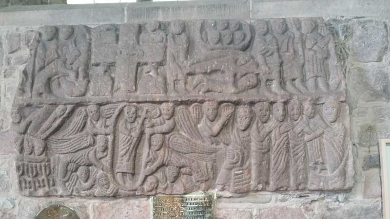 The Wirksworth Stone depicting the life of Christ in 8 panels.  It is located on the northern wall of the western part of the nave, to the right of the lead lined font which dates from the 13th century.  The Wirksworth Stone is particularly finely carved, having been found 2 feet below the surface of the pavement in front of the altar, with the carving face-down.  