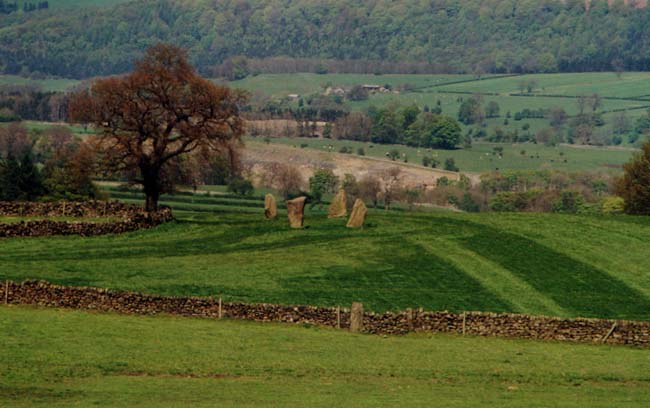 Nine Stones Close circle

A view of the circle taken from Robin Hood’s Stride.  The relocated upright can be seen in the drystone wall in the foreground.
