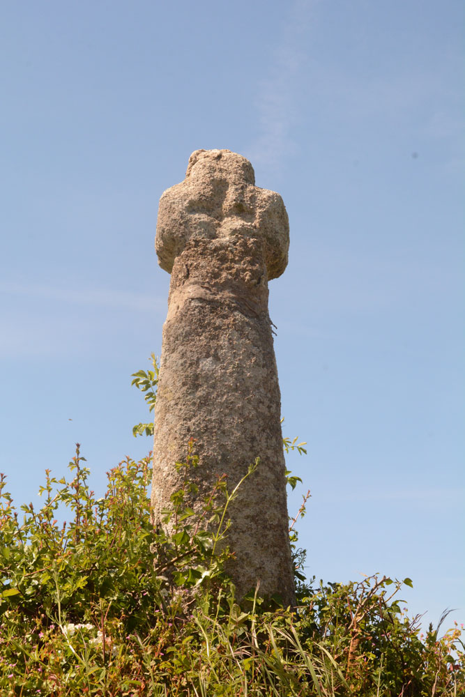 Standing on the farm track up to the gate into the field, just south of the cross, trying to get a good shot of the Greek cross on its eastern face. It showed up nicely because of the bright sunshine. The repair (done at least twice) at the top of the shaft is also clearly visible.