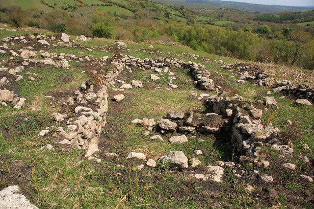 Hound Tor East prehistoric and medieval farmstead at SX 745791

Remains of a medieval longhouse on the site of prehistoric farmstead. The original farmstead was rebuilt in the 11th to 13th centuries.

Copyright Guy Wareham and licensed for reuse under the Creative Commons Licence.