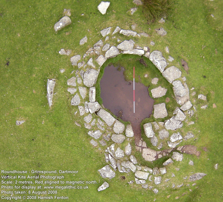 Grimspound, Dartmoor. Low Level Vertical Kite Aerial photograph of a roundhouse. The scale is aligned red to magnetic north. The scale is 2 metres long

Photo taken: 8 August 2008