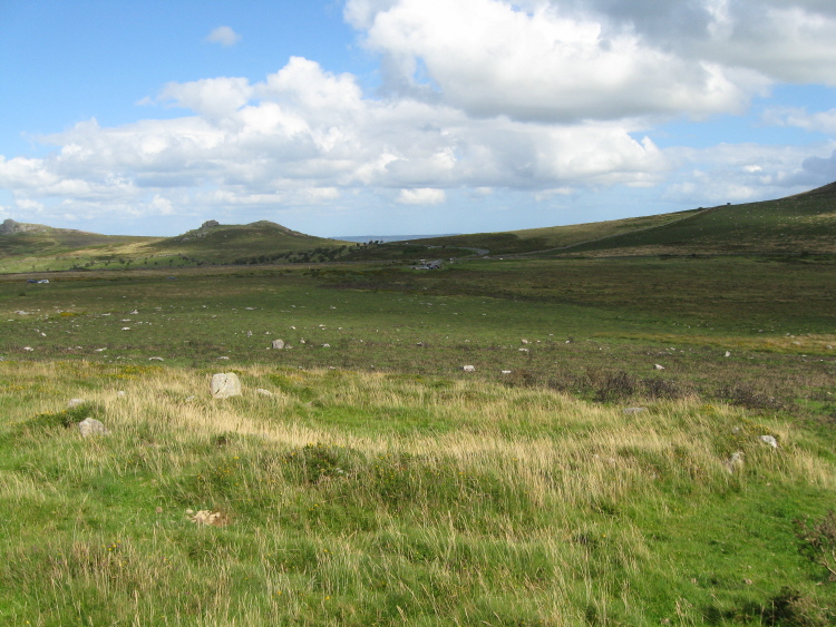 Returning downhill I came across the first hut I'd found, probably Hut 7 on the plan, with views here towards the Hemsworthy Gate road junction, and on its left, Saddle Tor, with Haytor Rocks extreme left.  The white dots are stones from the original walls of the fields of Foale's Arrishes.