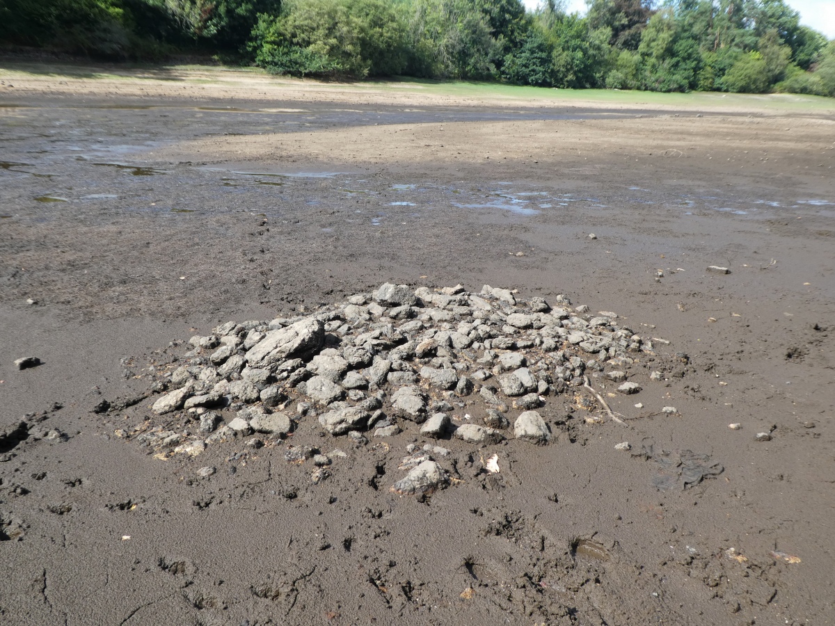 On the eastern shore of the lake, can be seen several round piles of stones, which may be ancient cairns, but I am not too convinced. 

This one near the Mound, which can be seen beyond