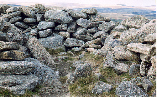Yar Tor Summit Cairn.  This shot shows a kerb-like stone between the 'passage' and the central area of the cairn