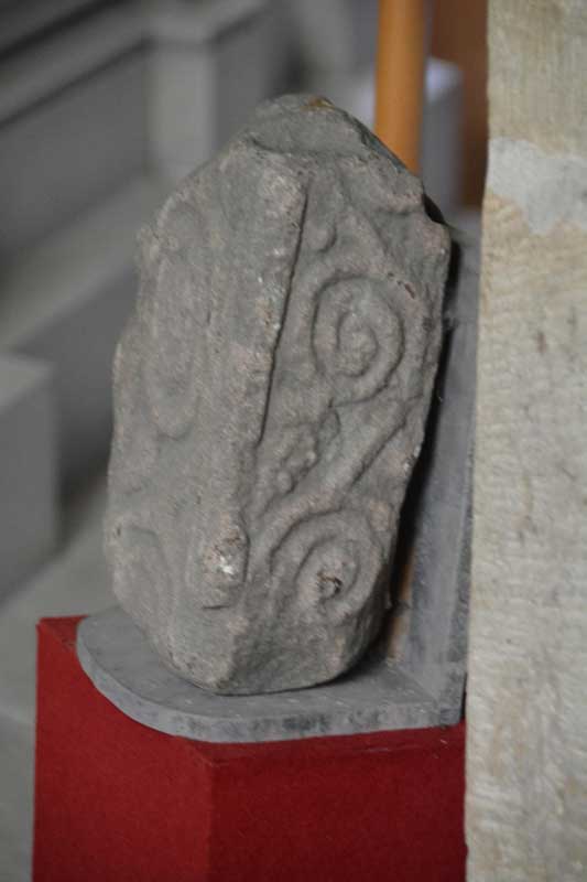 A photograph showing the side of the cross fragment inside the church.  As it was securely fastened to the wall, I was unable to turn it round to photograph the reverse side.