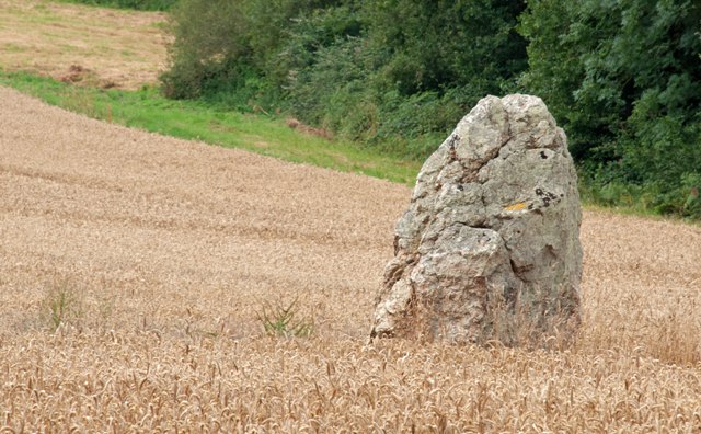 Bodel menhir is set in a valley surrounded by fields.