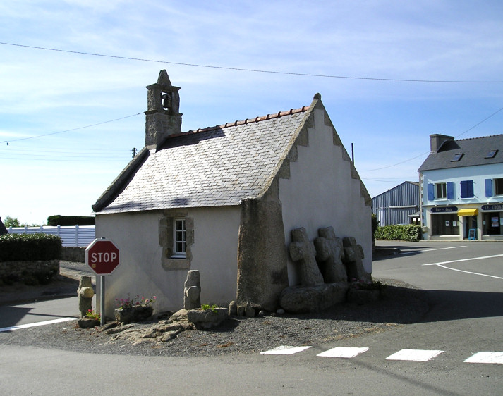 The little chapel at Croazou in its modern road junction.

The cornerstone is an Iron Age Stele, and the three medieval crosses by the back wall are sitting on a fallen menhir.

How much more continuity of somewhere being a sacred place can you get.