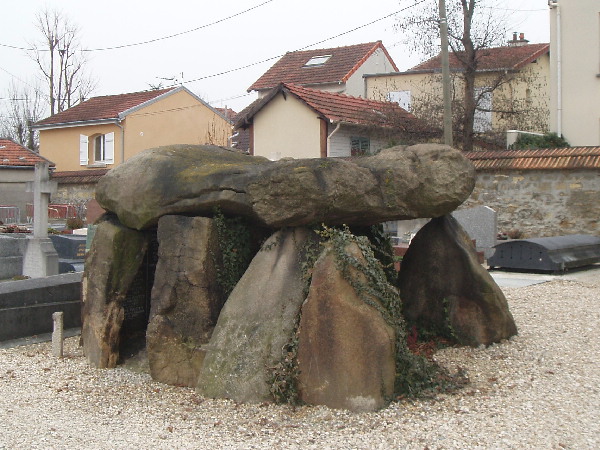 Dolmen taken from near Carnak in Bretagne and used  as a familly Croft by an Archeologist. The back stone is the modern familly grave stone with the names and dates and not original to the Dolmen, but was fit in rather elegantly. 