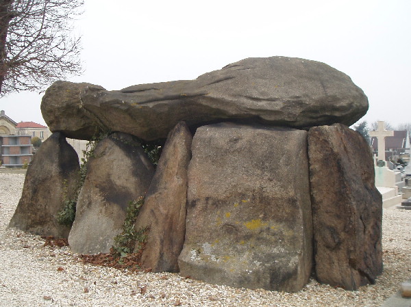 Dolmen taken from near Carnak in Bretagne and used  as a familly Croft by an Archeologist. The back stone is the modern familly grave stone with the names and dates and not original to the Dolmen, but was fit in rather elegantly. 
