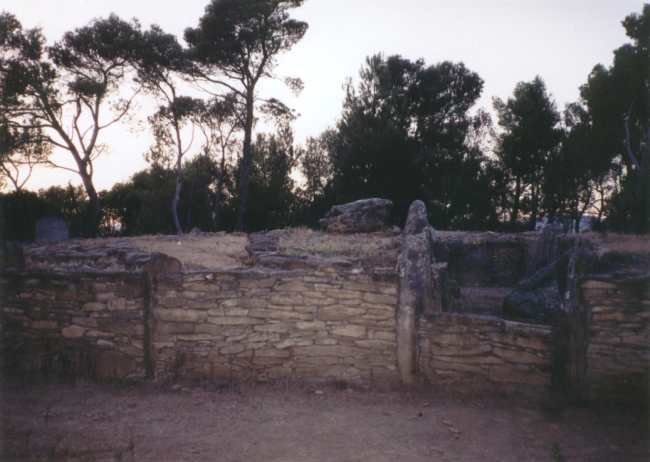 This is what I think is described as les Allees Couvertes de Saint- Eugene, . 

However, it was getting late and the roads and map didnt seem to match. I just followed signs to something like fairy hill, and on top of a hill was this amazing site, with a circular walled structure with various chambers and passages in it.