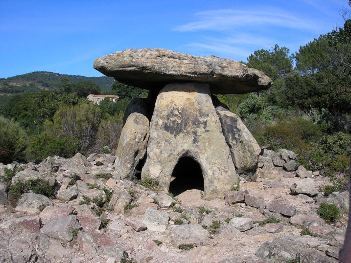 The southern entry face of this famed dolmen. 
Remains of the entry corridor through the cairn of red volcanic rock can be seen. 