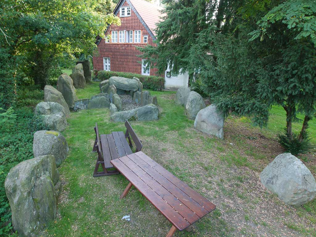 Long Barrow with Chambered Tomb in Saxony-Anhalt

This tomb belongs to the type of the passage graves and is
oriented northeast-southwest. The grave consisted of 14 wall
and several capstones (of the latter only one survived), surrounded
by a trapezoidal enclosure. This is no longer completely intact and still
consists of 19 stones. Its current length is about 26 m, but is estimated
to orig