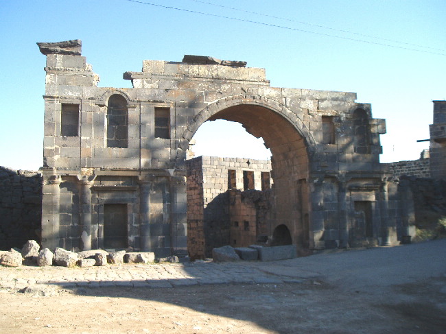 Former Nabatean town, taken over by the Romans. Here the Nabatean Gate.Here the Original Nabatean gate. The Nabateans were the ones who built Petra. 
The city also has a very large reservoir, a theatre, a forum, bath and a colonnade as well as early churches.