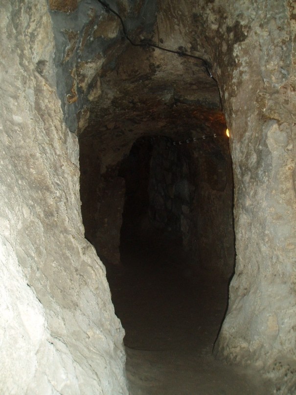 Passageway of Cappodacian Underground city dating to about 1000-800 BCE when Assyrian where troubling the remnants of the Hittites.
Later the underground cities where reused by christians fleeing Roman persecutıons.
The shafts go about 45 Meters deep in about 8 levels. 
In the last 1800 years local farmers used them for holding sheep and storing grain and wine. The cıte was only officıally r
