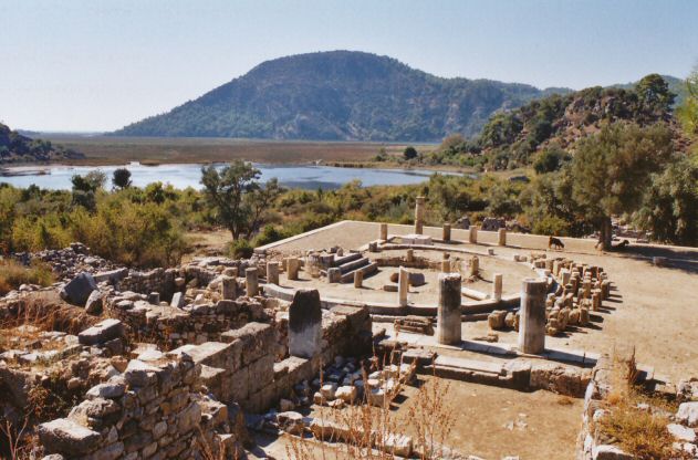 An unknown building, possibly a fountain or a ritual bathing pool, viewed from a temple.  The sea used to come up to the lake, where there is a harbour, but it is now behind the hill.