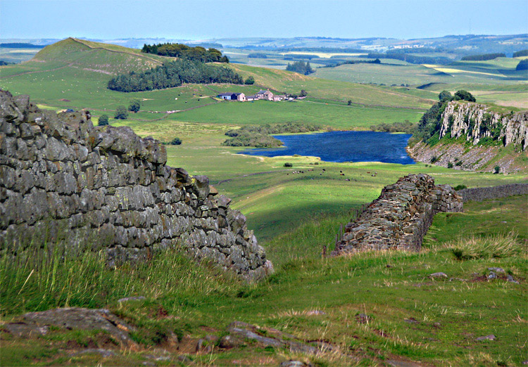 Roman Gallery. Hadrians wall AD 122 - looking East towards Crag lough (a local name for a small lake) and the cliffs of the Whin Sill.The Whin Sill is hard weather resistant rock (dolerite)which is eroded less, and therefore stands out, and grows relation to the sinking surroundings.The roman wall undulates over the highest points, coast to coast, and was the Roman's emphatic stamp!  - to show the