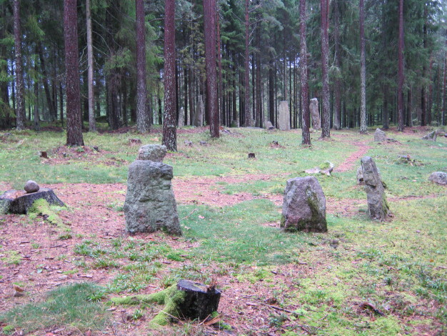 The site around a kilometre from the road on a pleasant forest walk through Bronze Age and Iron Age remains.  September 2011. 