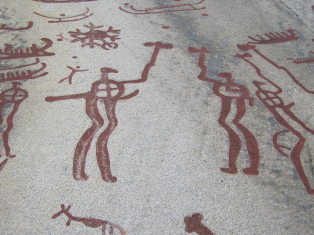 A battle scene - either real or ritualistic.  Behind and above the warriors the circle is interpreted as the sun with its rays flowing from it.  September 2011.