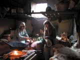Middle-earth Gallery
Rohan - typical home of the Rohirrim
Return of the King
Book V Chapter V
Gary (aka. Wayland) Debbie and Skadi (the dog) in our house on the Viking Village at Murton Park nr. York