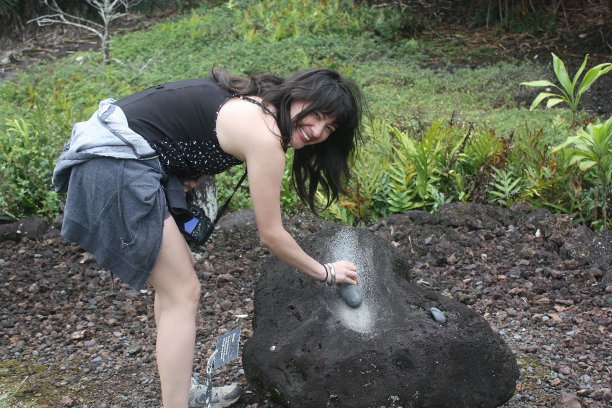 Heiau Demonstration - Lluvia demonstrates the use of an old Hawaiian grinding stone at Kahanu Gardens, a detour on the Road to Hana.

Photo Credit: Jenna Rose Robbins