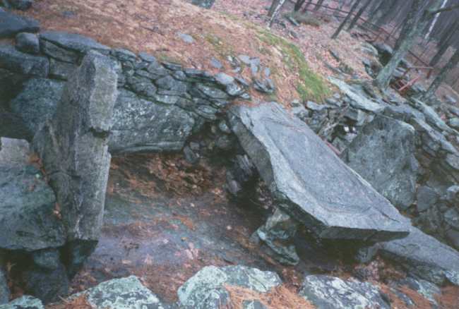 The sacrificial table at Mystery Hill, also known as America's Stonehenge, near Salem, New Hampshire.  Is it an ancient site or a fairly modern construction ? They say its over 4000 years old, but who built it ? 

When I visited 10 to 15 years ago it was a really horrible wet day, so I didnt get many pictures. And I have to say, that despite their best efforts to assure me that carbon dating of 